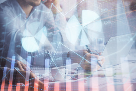 Multi exposure of man and woman working together and financial chart hologram. Business concept. Computer background.の写真素材