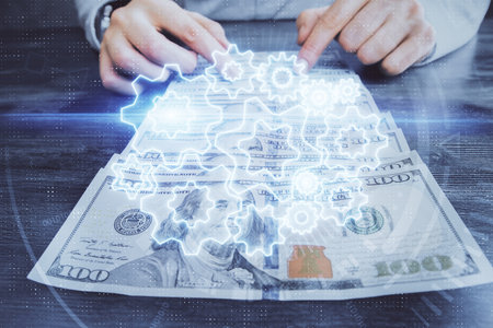 Multi exposure of financial theme drawing hologram and USA dollars bills and man hands. Business concept.の写真素材