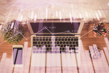 Multi exposure of financial chart drawing over table background with computer. Concept of research and analysis. Top view.の写真素材
