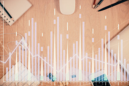 Multi exposure of forex graph hologram over desktop with phone. Top view. Mobile trade platform concept.の写真素材