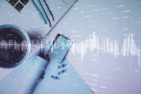 Double exposure of forex graph drawing over desktop background with computer. Concept of financial...