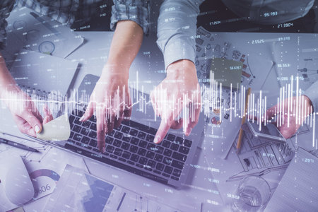 Double exposure of man and woman working together and forex graph hologram drawing. Financial...