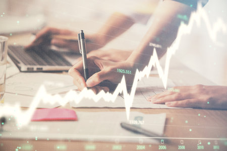 Multi exposure of woman hands typing on computer and financial chart hologram drawing. Stock market analysis concept.の写真素材