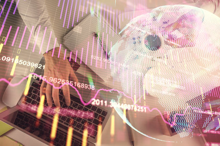 Multi exposure of mans hands typing over computer keyboard and forex graph hologram drawing. Top view. Financial markets concept.の写真素材