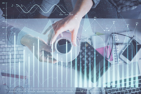Double exposure of man and woman working together and financial chart hologram drawing. market...