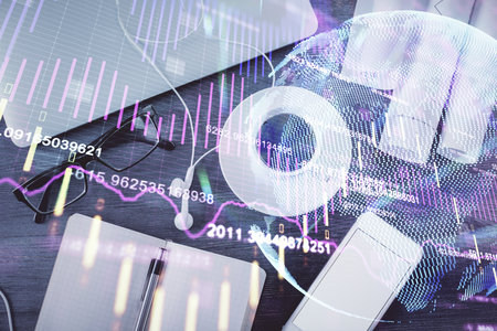 Multi exposure of forex graph drawing over desktop background with computer. Concept of financial analysis. Top view.の写真素材