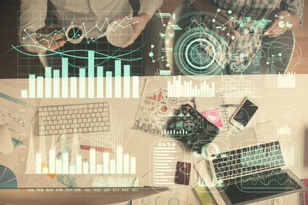 Double exposure of man and woman working together and financial chart hologram drawing. market...