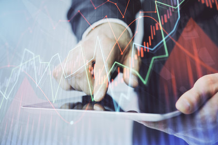 Multi exposure of mans hands holding and using a phone and financial chart drawing. Market analysis concept.の写真素材