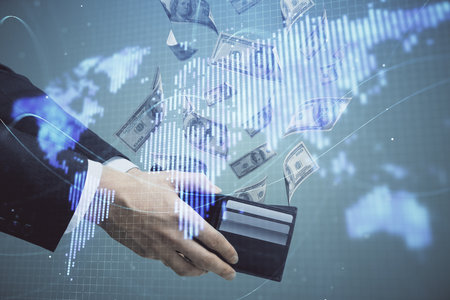 Multi exposure of financial theme drawing hologram and USA dollars bills and man hands. Business concept.の写真素材