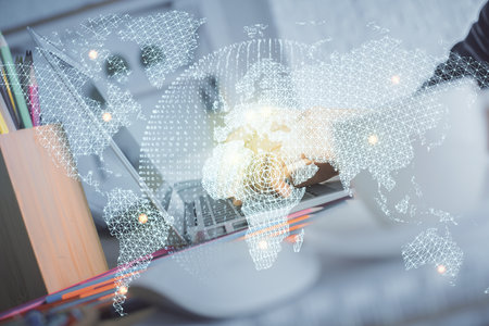 Double exposure of woman hands typing on computer and business theme hologram drawing. Success...