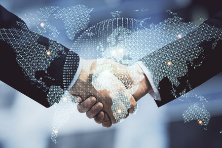 Double exposure of business theme hologram and handshake of two men. Success concept.の写真素材