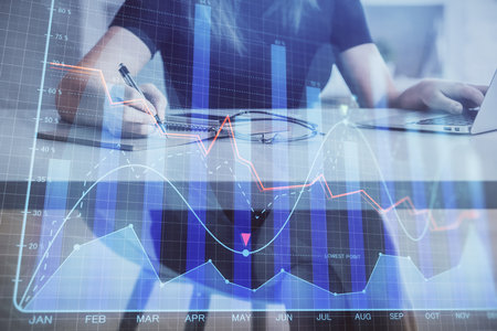 Double exposure of businesswoman hands typing on computer and forex chart hologram drawing. Financial analysis concept.の写真素材