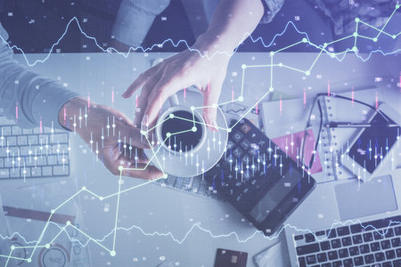 Double exposure of man and woman working together and financial chart hologram drawing. market...