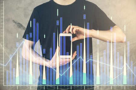 Double exposure of mans hands holding and using a digital device and forex graph drawing. Financial market concept.の写真素材