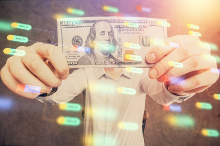 Double exposure of technology drawing hologram and us dollars bills and man hands. Data conceptの写真素材