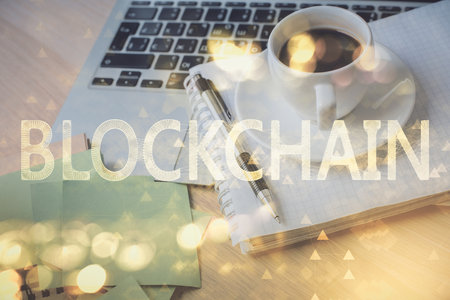 Double exposure of crypto technology drawing and desktop with coffee and items on table background. Concept of blockchainの写真素材