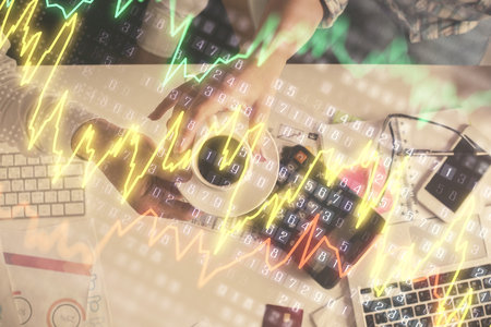 Double exposure of man and woman working together and financial chart hologram drawing. market...