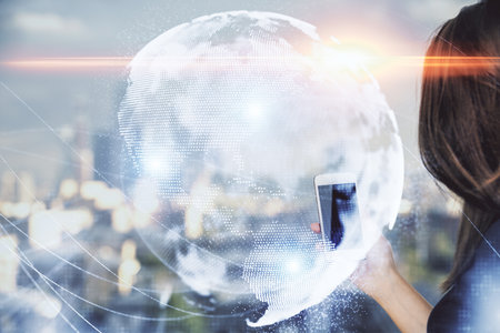 Double exposure of business theme sketch hologram and woman holding and using a mobile device.の写真素材