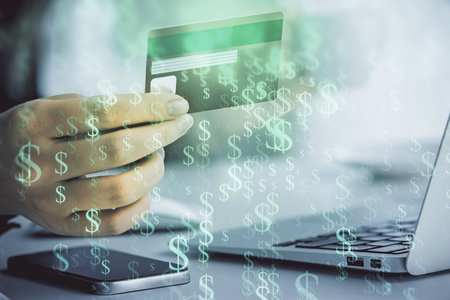 Multi exposure of woman on-line shopping holding a credit card and financial graph drawing. Stock market E-commerce concept.の写真素材