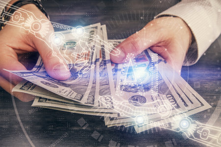 Multi exposure of technology drawing hologram and us dollars bills and man hands. Data conceptの写真素材
