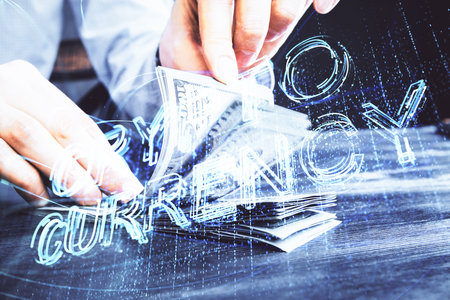 Multi exposure of blockchain theme drawing hologram and USA dollars bills and man hands. Business concept.の写真素材