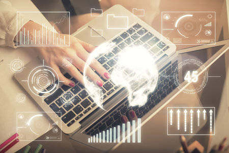 Double exposure of woman hands typing on computer and financial graph hologram drawing. Stock market...
