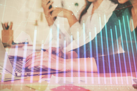 Multi exposure of woman hands typing on computer and financial graph hologram drawing. Stock market analysis concept.の写真素材
