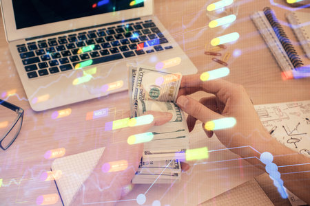 Multi exposure of technology drawing hologram and us dollars bills and man hands. Data conceptの写真素材