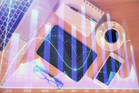 Multi exposure of forex graph hologram over desktop with phone. Top view. Mobile trade platform concept.の写真素材