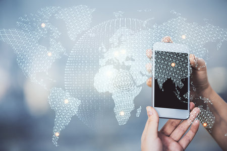 Double exposure of business theme sketch hologram and woman holding and using a mobile device.