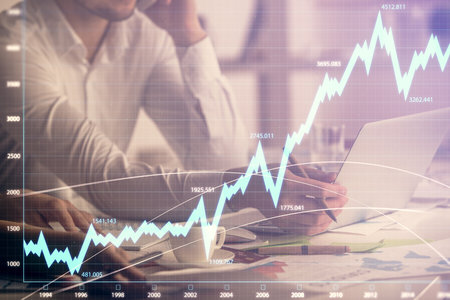 Multi exposure of man and woman working together and financial chart hologram. Business concept. Computer background.の写真素材