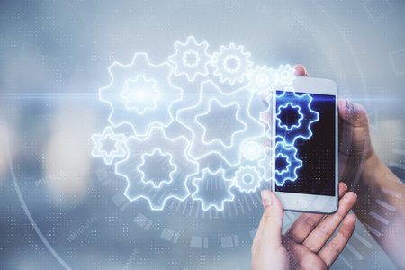 Double exposure of business theme sketch hologram and woman holding and using a mobile device.の写真素材