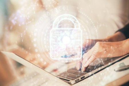 Double exposure of woman hands working on computer and lock hologram drawing. Security concept.