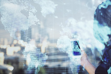 Double exposure of business theme sketch hologram and woman holding and using a mobile device.