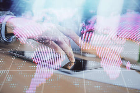 Double exposure of business theme drawing and man and woman working together holding and using a...