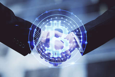 Double exposure of blockchain hologram and handshake of two men. Crypto business concept.