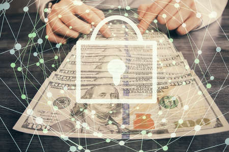 Double exposure of lock drawing hologram and us dollars bills and man hands. Security concept