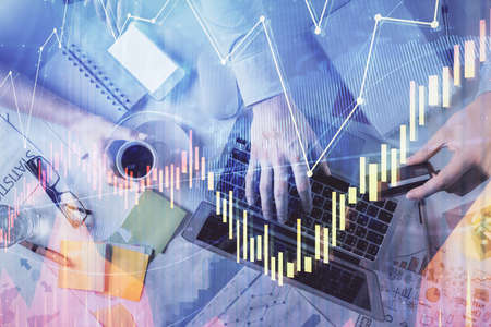 Double exposure of man and woman working together and forex graph hologram drawing. Financial...