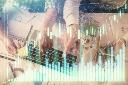 Multi exposure of man and woman working together and forex graph hologram drawing. Financial...