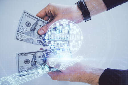Multi exposure of blockchain theme drawing hologram and USA dollars bills and man hands. Business concept.の写真素材