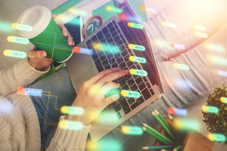 Double exposure of woman hands working on computer and data theme hologram drawing. Tech concept.