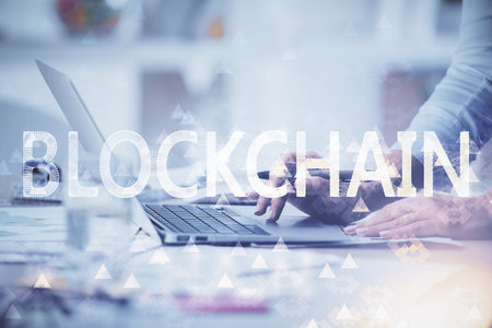 Double exposure of woman hands typing on computer and crypto market theme hologram drawing. Blockchain concept.の写真素材