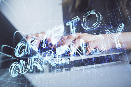 Double exposure of woman hands typing on computer and crypto market theme hologram drawing....