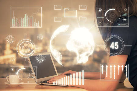 Double exposure of businesswoman hands typing on computer and forex chart hologram drawing....