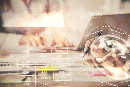 Multi exposure of woman hands typing on computer and forex chart hologram drawing. Stock market...