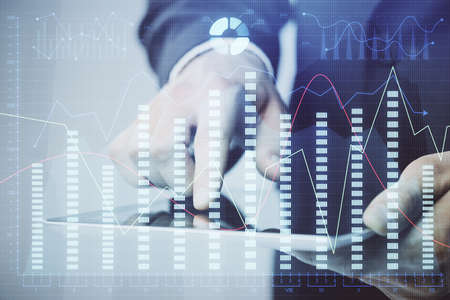 Multi exposure of mans hands holding and using a phone and financial chart drawing. Market analysis...