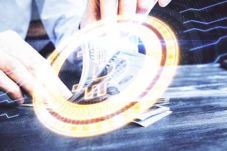 Multi exposure of blockchain theme drawing hologram and USA dollars bills and man hands. Business...