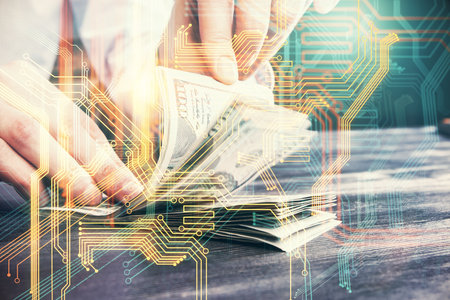 Double exposure of world map drawing hologram and us dollars bills and man hands.の写真素材