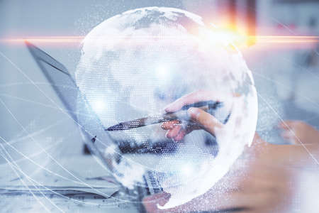 Multi exposure of woman hands typing on computer and business theme hologram drawing. Success concept.の写真素材
