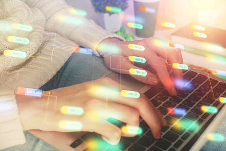 Double exposure of woman hands working on computer and data theme hologram drawing. Tech concept.
